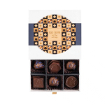 Caixa de 9 bombons de chocolate de leite, recheio de café ou ameixas cor branco
