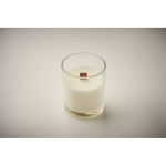 Vela de cera vegetal com aroma a baunilha e pavio de madeira cor transparente vista fotografia segunda vista