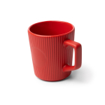 Caneca de cerâmica 320 ml com exterior mate e design canelado cor vermelho primeira vista de uso