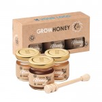Frascos de mel e colher de mel em madeira vista principal