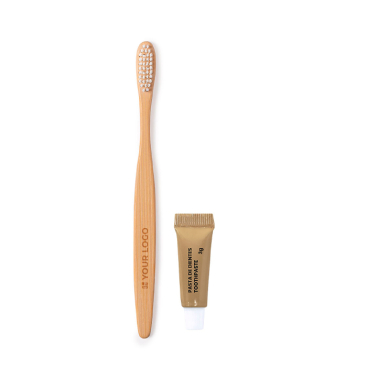 Escova de dentes de bambu e pasta dentífrica em caixa de cartão
