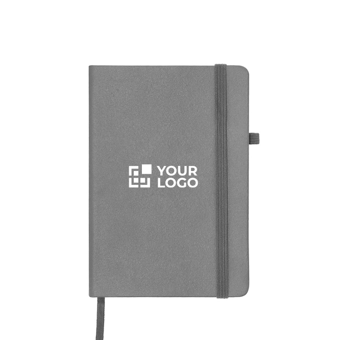 Caderno capa de couro sintético e fecho elástico, folhas pautadas A5