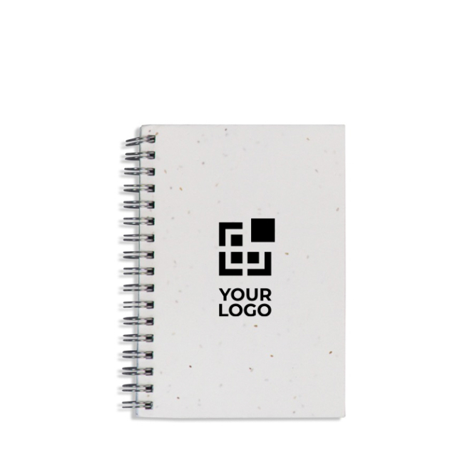 Caderno ecológico com capa de sementes e folhas quadriculadas vista principal